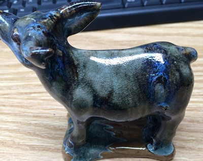 Lot 42 - A Chinese glazed stoneware model of a cow,...