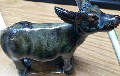 Lot 42 - A Chinese glazed stoneware model of a cow,...