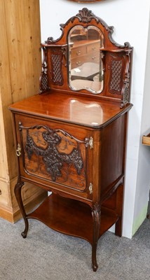 Lot 1129 - An Edwardian music cabinet with mirrored back...