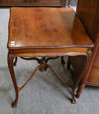 Lot 1200 - A mahogany lamp table with shaped X-form...