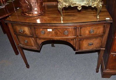 Lot 438 - A 19th century mahogany bow front kneehole dressing table