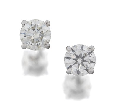 Lot 2029 - A Pair of Diamond Solitaire Earrings