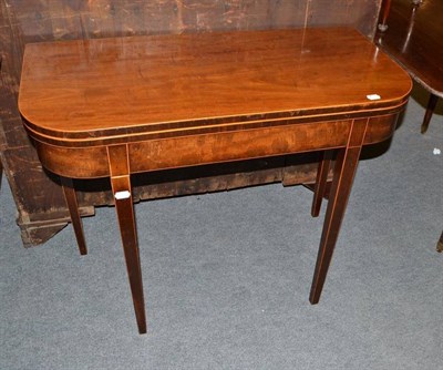 Lot 448 - A 19th century mahogany fold over tea table