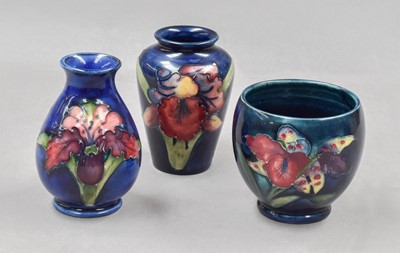 Lot 141 - Three Walter Moorcroft Orchid pattern vases,...