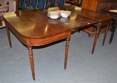 Lot 451 - Early 19th century mahogany dining table, fitted with an additional leaf