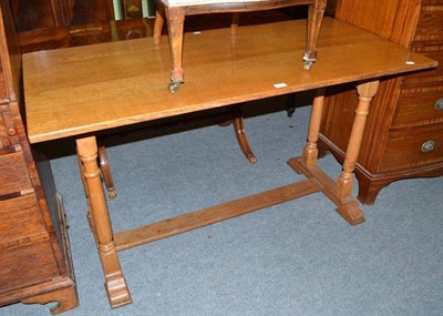 Lot 453 - A blonde oak small dining table