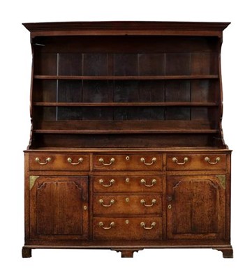 Lot 758 - A George III Oak Enclosed Dresser and Rack,...