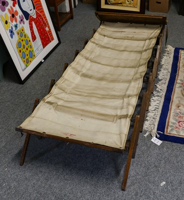 Lot 1177 - An Early 20th century Cabinetta Oak Campaign Bed