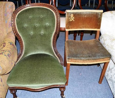 Lot 464 - A Victorian walnut-framed nursing chair with bead and ribbon carved decoration and a George VI...