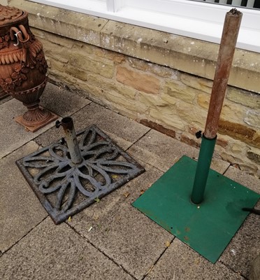 Lot 1116 - Two cast metal garden umbrella stands