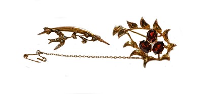 Lot 73 - A 9 carat gold garnet brooch, length 4.2cm;...