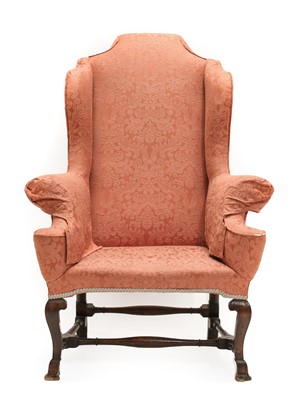 Lot 905 - A Queen Anne Style Wing-Back Chair, late 19th...