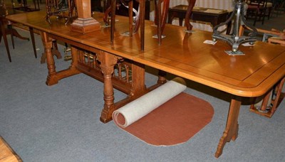 Lot 480 - A blonde oak extending dining table