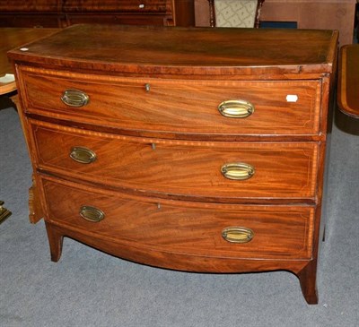 Lot 483 - A Regency mahogany bow front chest of three drawers