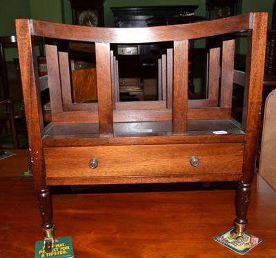 Lot 490 - A mahogany three division late Georgian style Canterbury, with single drawer and four brass castors