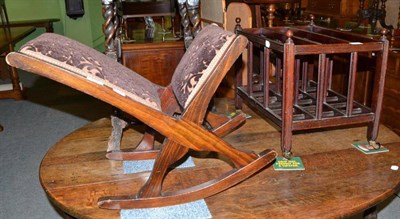 Lot 493 - A Georgian style mahogany Canterbury with reeded frame and a gout stool