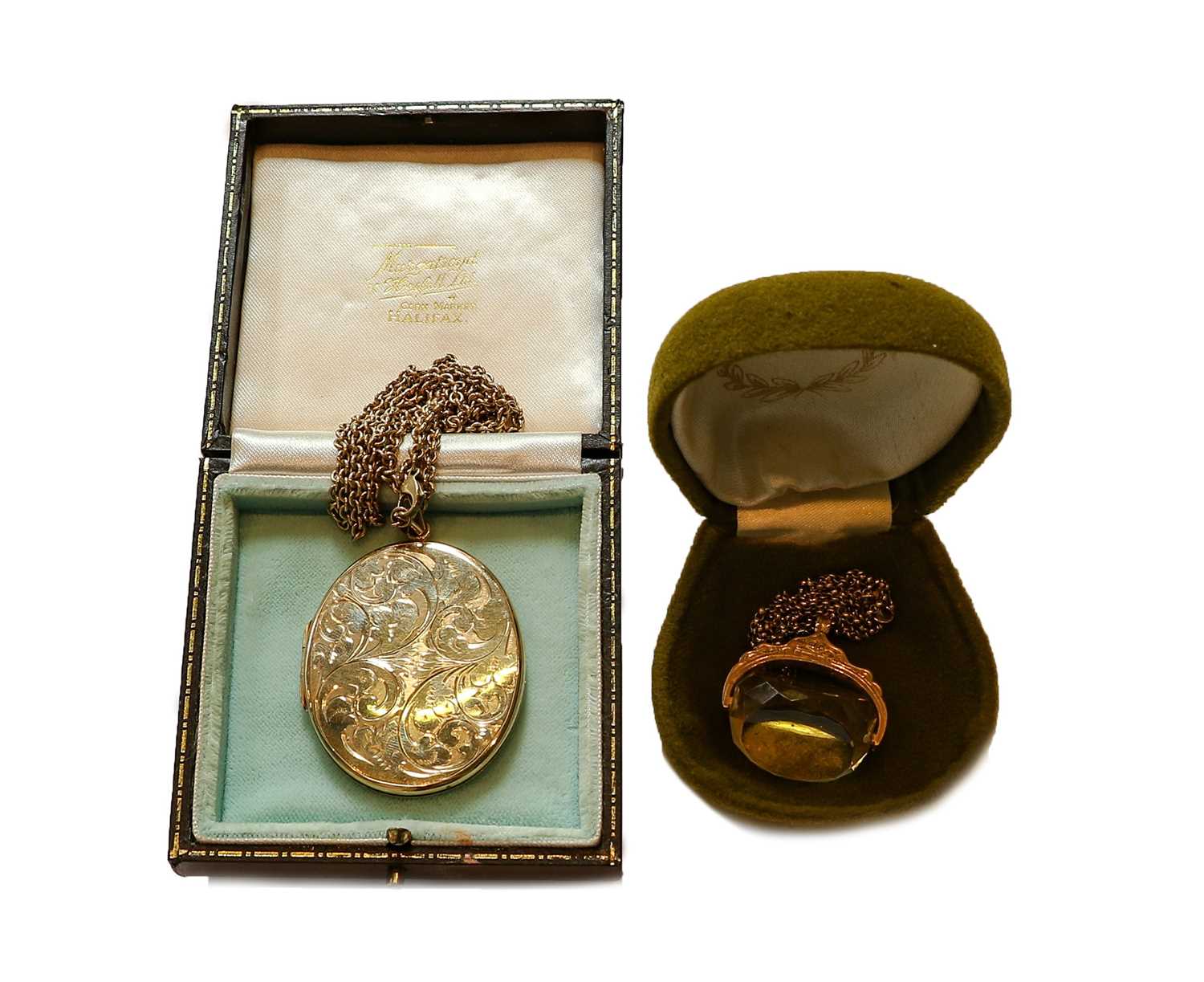 Lot 85 - A 9 carat gold citrine swivel seal on chain,...