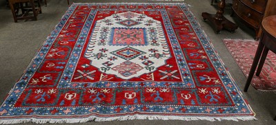 Lot 1212 - Turkish Carpet, The ivory lozenge field of...