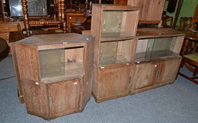 Lot 503 - Four small limed oak bookcases with sliding glass doors