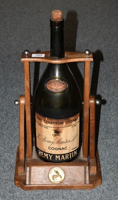 Lot 83 - A Remy Martin bottle turner