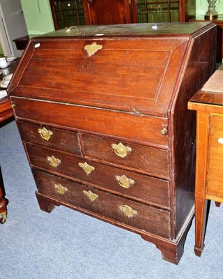 Lot 516 - An early 18th century oak bureau