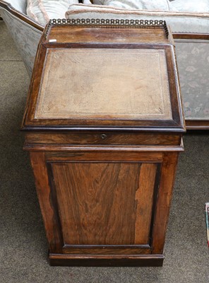 Lot 1339 - A 19th-century rosewood Davenport, (heavily...