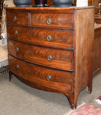 Lot 1348 - A George III mahogany bow fronted four height...