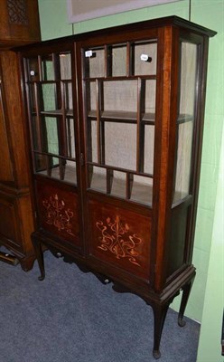 Lot 525 - An Edwardian inlaid mahogany display cabinet