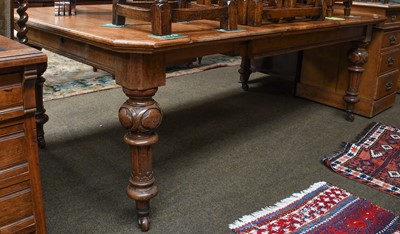 Lot 1352 - A late Victorian oak wind-out dining table...