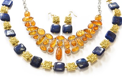Lot 143 - A lapis lazuli necklace and a pair of matching...