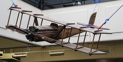 Lot 338 - A large wooden model aeroplane based on a...