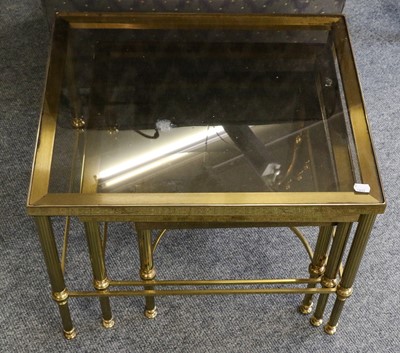 Lot 1243 - A set of three modern brass nesting tables on...