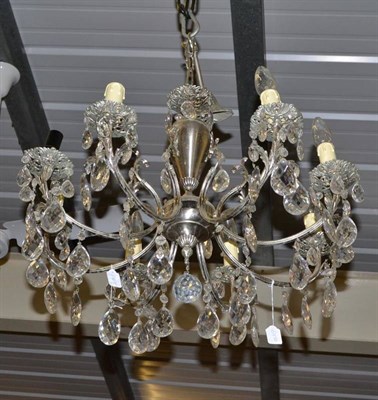 Lot 533 - An eight branch silvered metal chandelier