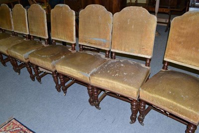 Lot 549 - A set of twelve Victorian mahogany framed dining chairs, with upholstered seats and back (in...