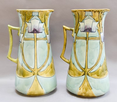 Lot 11 - A pair of Minton Secessionist No.13 jugs, with...