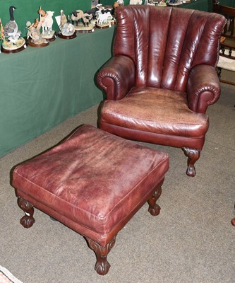 Lot 1318 - A modern leather Chesterfield arm chair and...