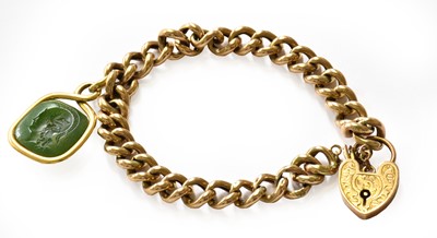 Lot 117 - A curb link bracelet with a padlock clasp,...