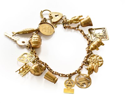 Lot 116 - A trace link charm bracelet with a 9 carat...