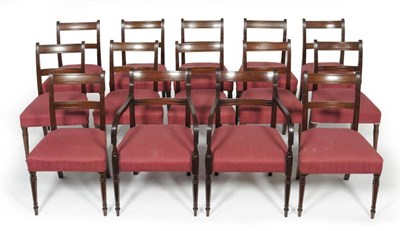 Lot 1232 - Twelve Late George III Mahogany Dining Chairs, with plain horizontal back supports, later recovered