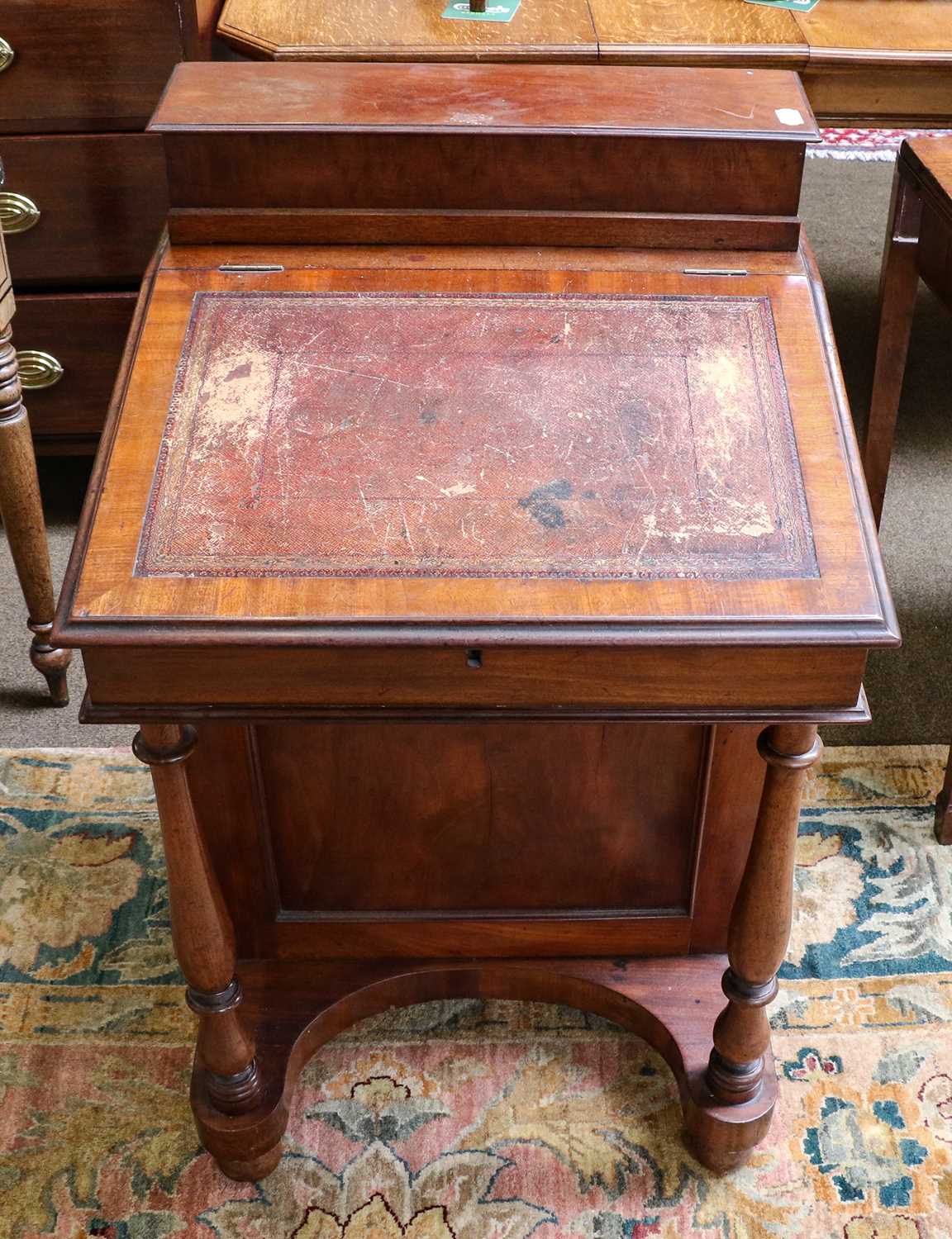 Lot 1341 - A Victorian mahogany Davenport, signed under...