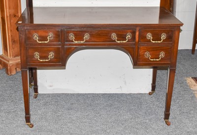 Lot 1254 - A mahogany five drawer desk 105cm by 51cm by 75cm