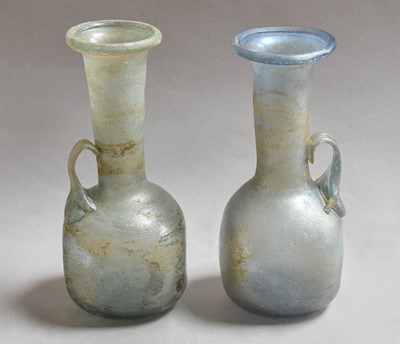Lot 206 - Two Roman-style glass ewers, largest 18.5cm