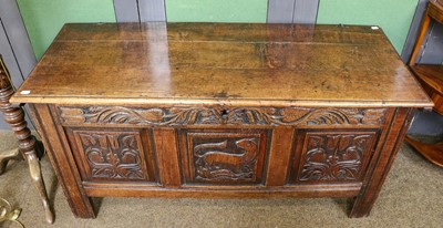 Lot 1372 - A 17th century oak coffer, the frieze carved...