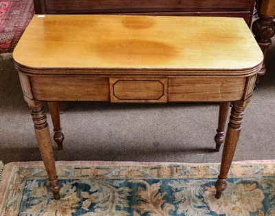 Lot 1343 - A 19th century mahogany fold over tea table,...