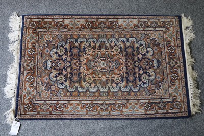 Lot 1021 - Indian Carpet, salmon pink field of leafy...