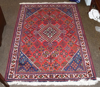 Lot 1215 - Joshaghan rug the crimson diamond lattice...