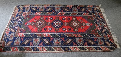 Lot 1228 - Dosemealti rug, the raspberry lozenge field...