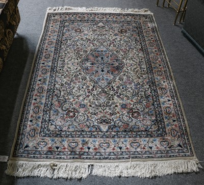 Lot 1230 - Kashmir part silk rug, the ivory field around...