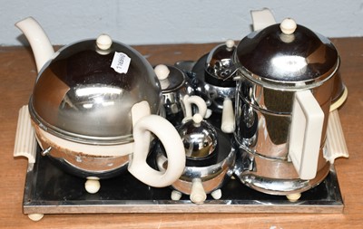 Lot 260 - An Art Deco PB metal mounted pottery teaset,...