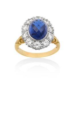 Lot 2236 - An 18 Carat Gold Sapphire and Diamond Cluster Ring